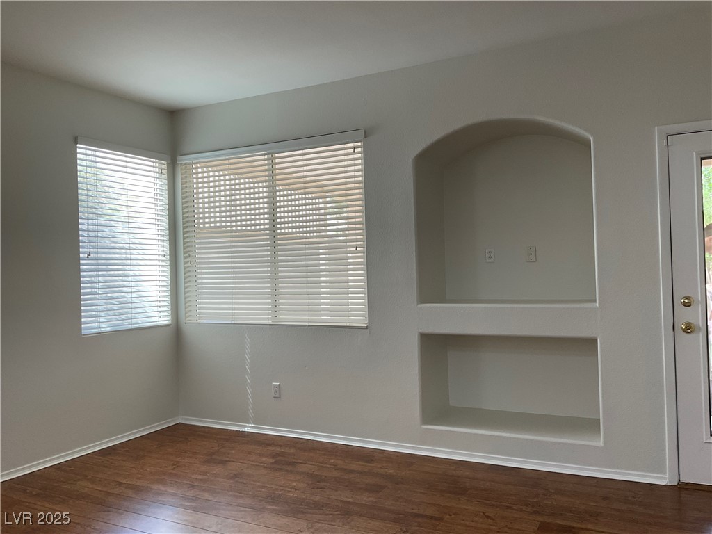 7620 Donald Nelson Avenue Las Vegas, NV 89131 - Photo 9 of 34 Unfurnished room with wood finished floors and baseboards