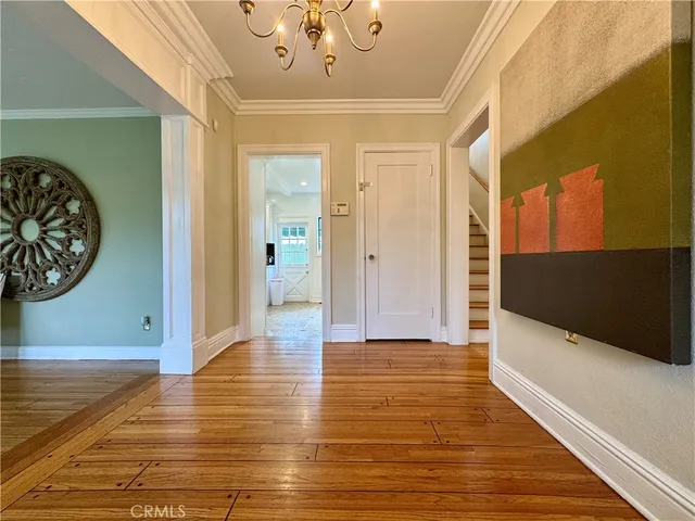 a bedroom with two beds and a window