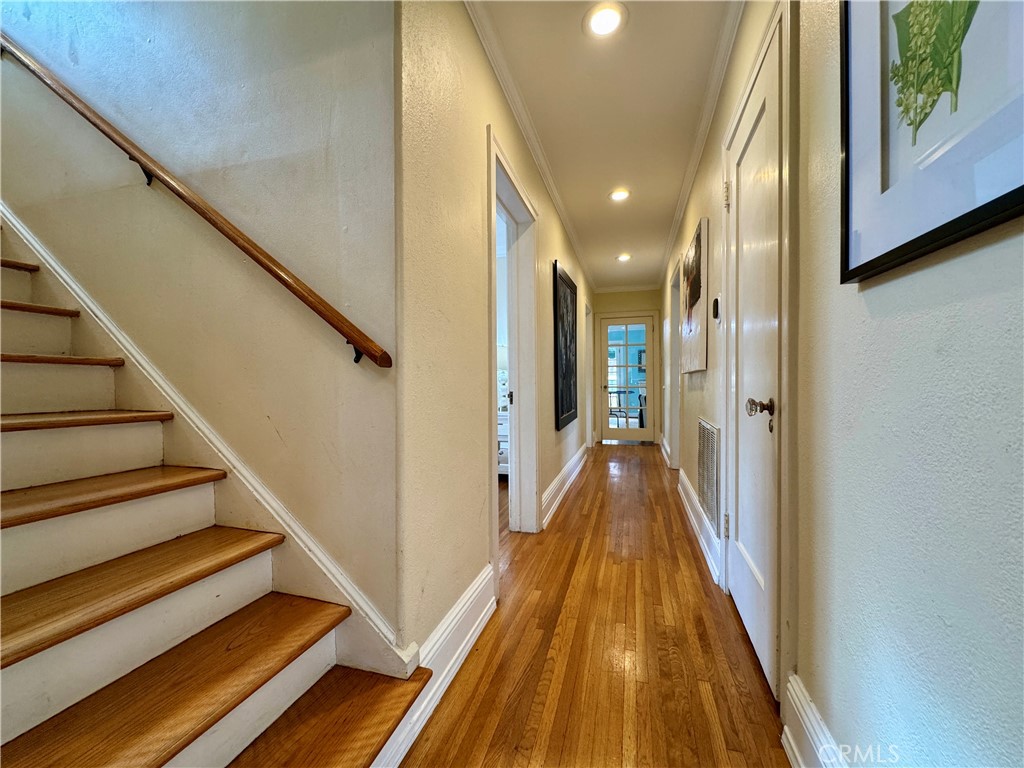 1149 Cordova Avenue Glendale, CA 91207 - Photo 24 of 65 a view of a hallway with wooden floor and staircase