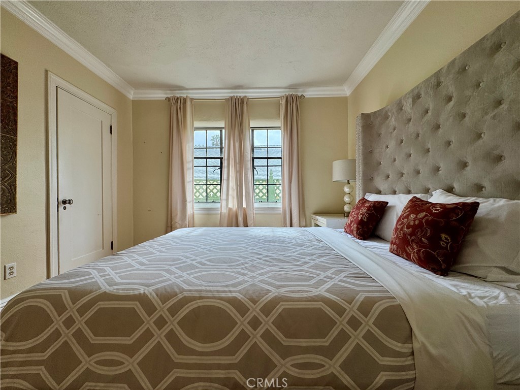 1149 Cordova Avenue Glendale, CA 91207 - Photo 29 of 65 a bedroom with a large bed and a window