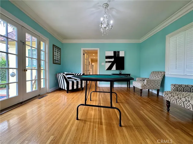 a bed room with a bed and a chandelier