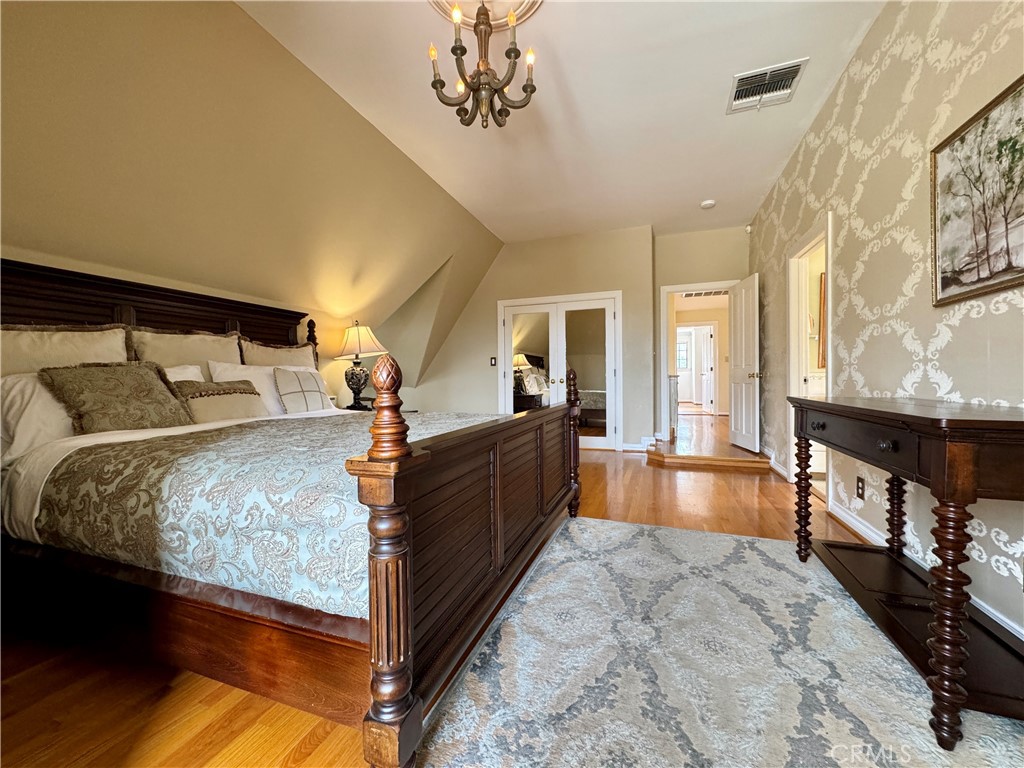 1149 Cordova Avenue Glendale, CA 91207 - Photo 45 of 65 a bed room with a bed and a chandelier