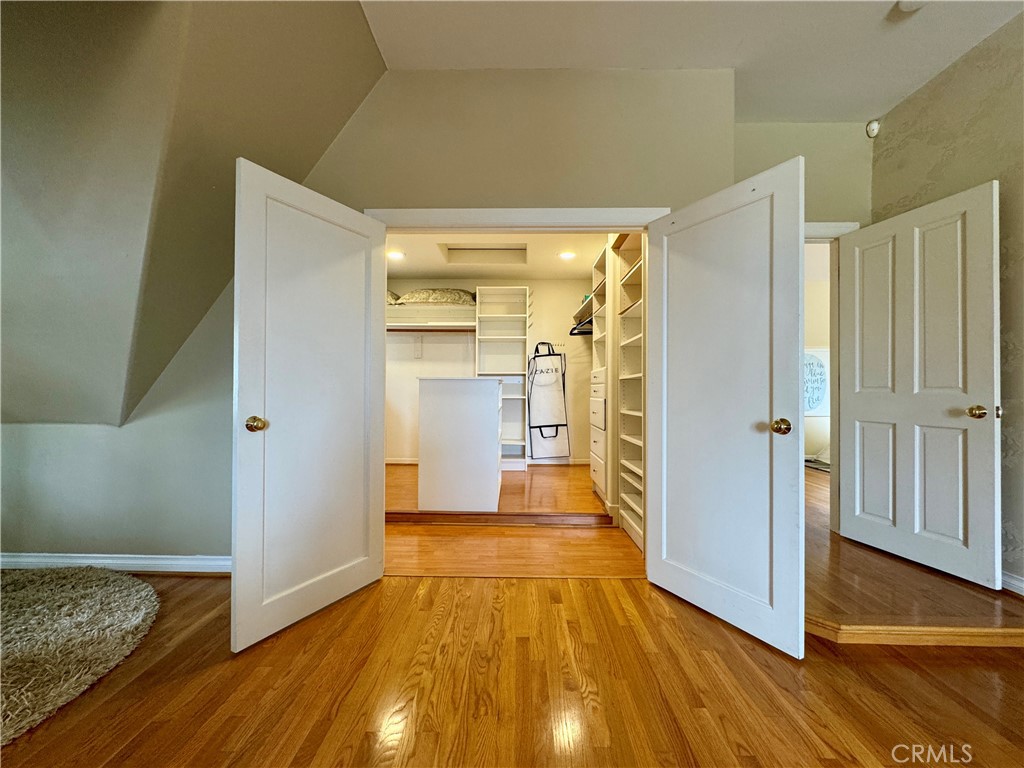 1149 Cordova Avenue Glendale, CA 91207 - Photo 46 of 65 a view of a hallway with wooden floor and cabinets