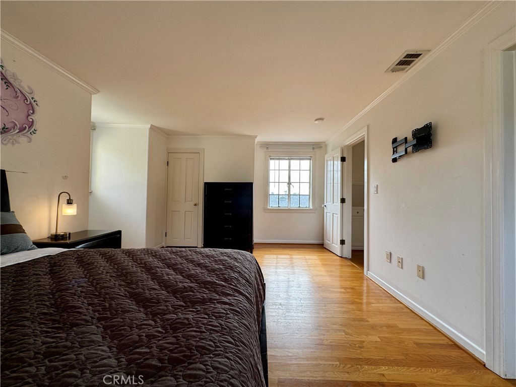 1149 Cordova Avenue Glendale, CA 91207 - Photo 48 of 65 a large bedroom with a bed and wooden floor