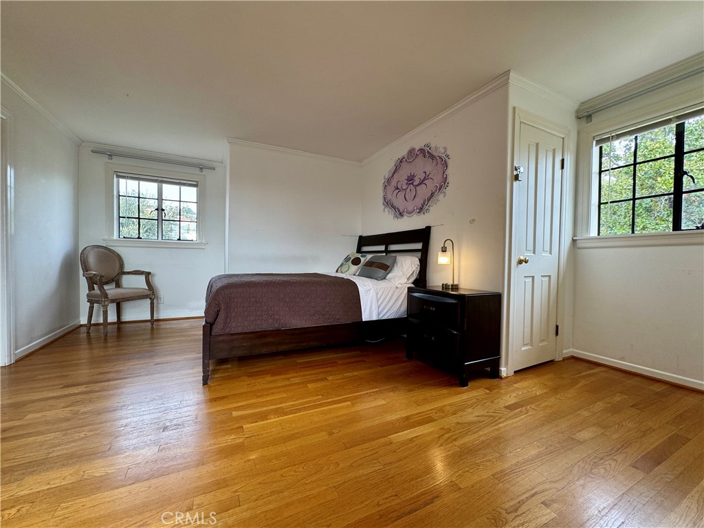 1149 Cordova Avenue Glendale, CA 91207 - Photo 50 of 65 a bedroom with a bed and wooden floor