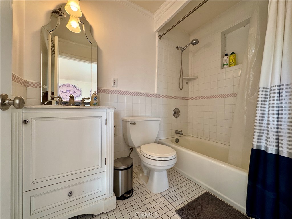 1149 Cordova Avenue Glendale, CA 91207 - Photo 51 of 65 a bathroom with a sink toilet a mirror and shower