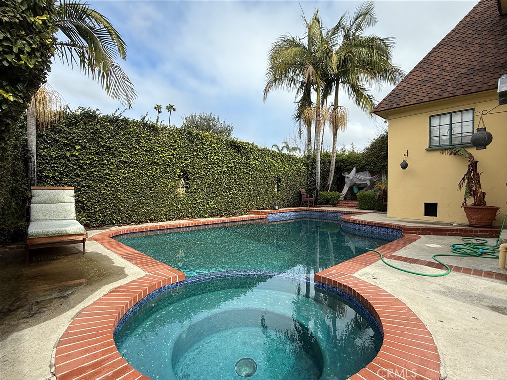 1149 Cordova Avenue Glendale, CA 91207 - Photo 58 of 65 a view of a swimming pool with a yard and palm trees