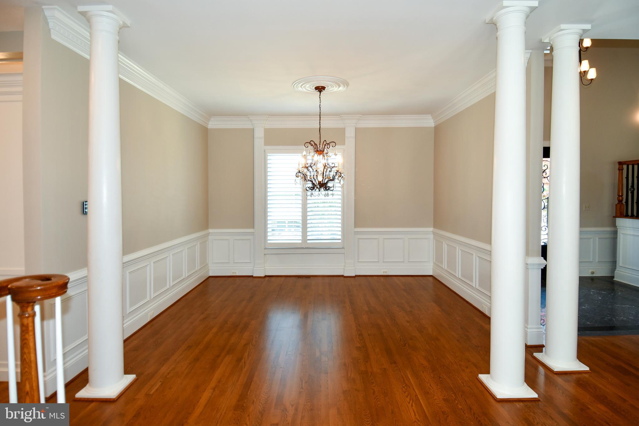 7808 Southdown Road Alexandria, VA 22308 - Photo 32 of 99 a view of an empty room with wooden floor and a window