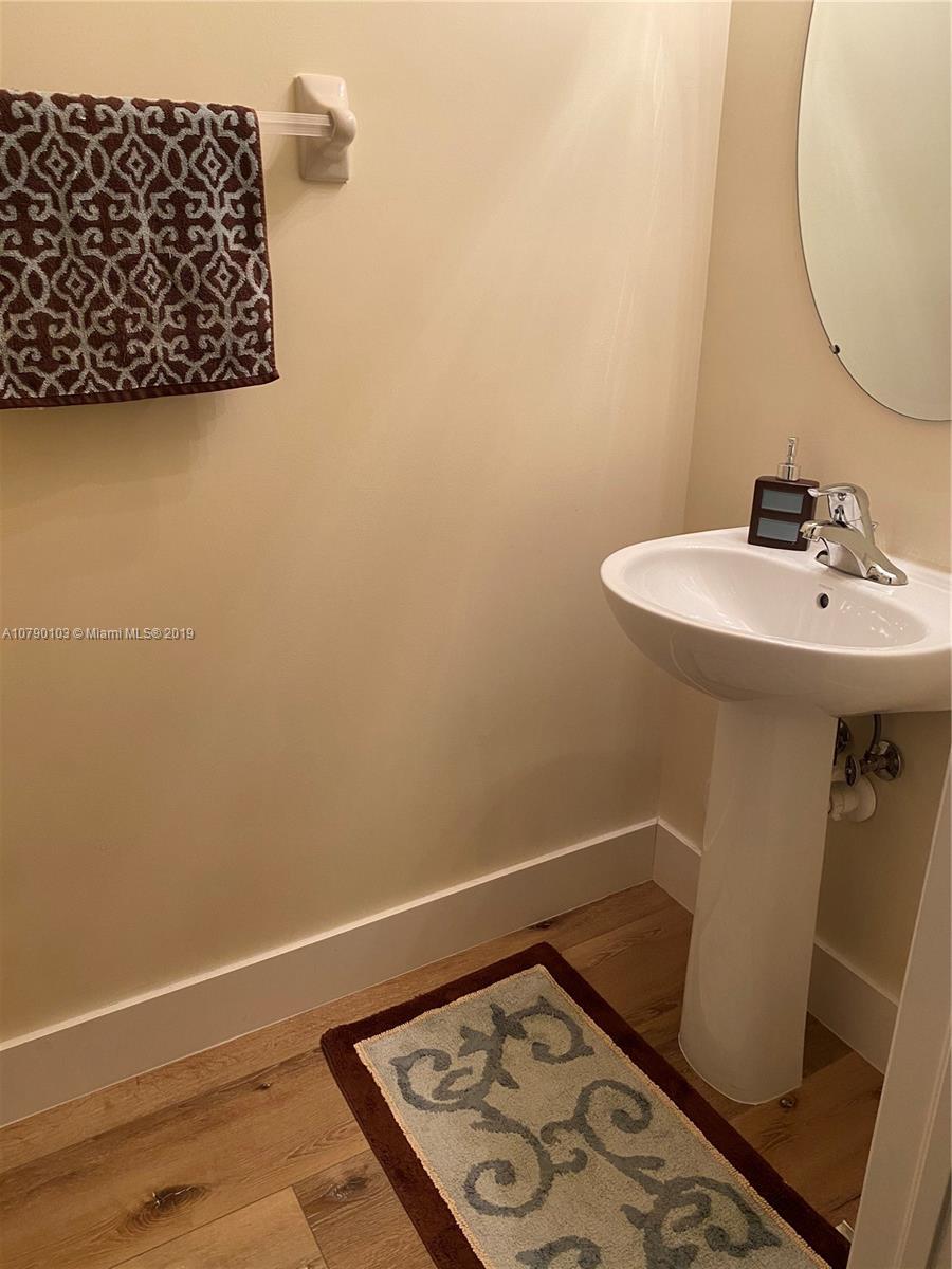 3436 West 90th Street, Unit 3436 Hialeah, FL 33018 - Photo 15 of 56 a bathroom with a sink and a mirror