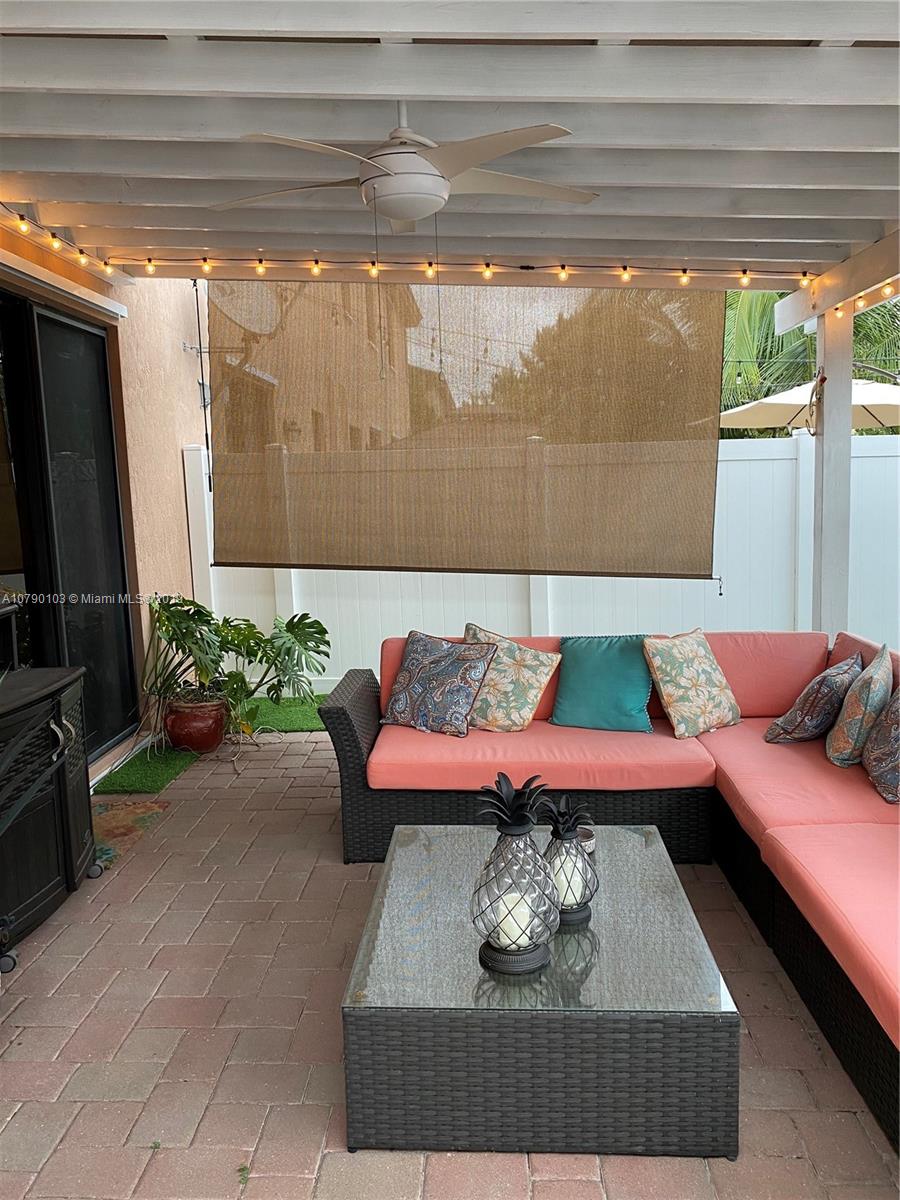 3436 West 90th Street, Unit 3436 Hialeah, FL 33018 - Photo 17 of 56 a living room with furniture and a flat screen tv