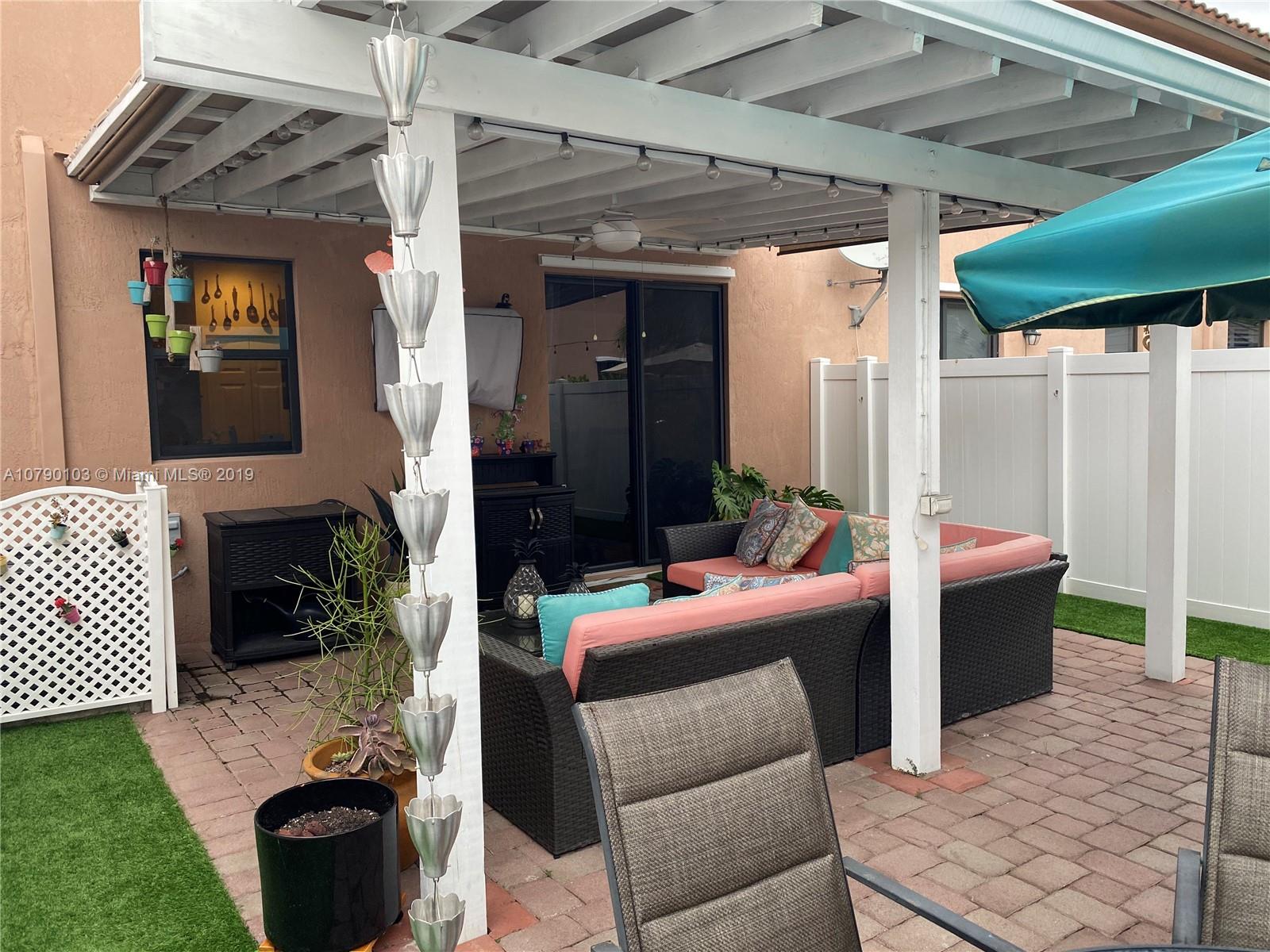 3436 West 90th Street, Unit 3436 Hialeah, FL 33018 - Photo 19 of 56 a outdoor space with patio couch and furniture