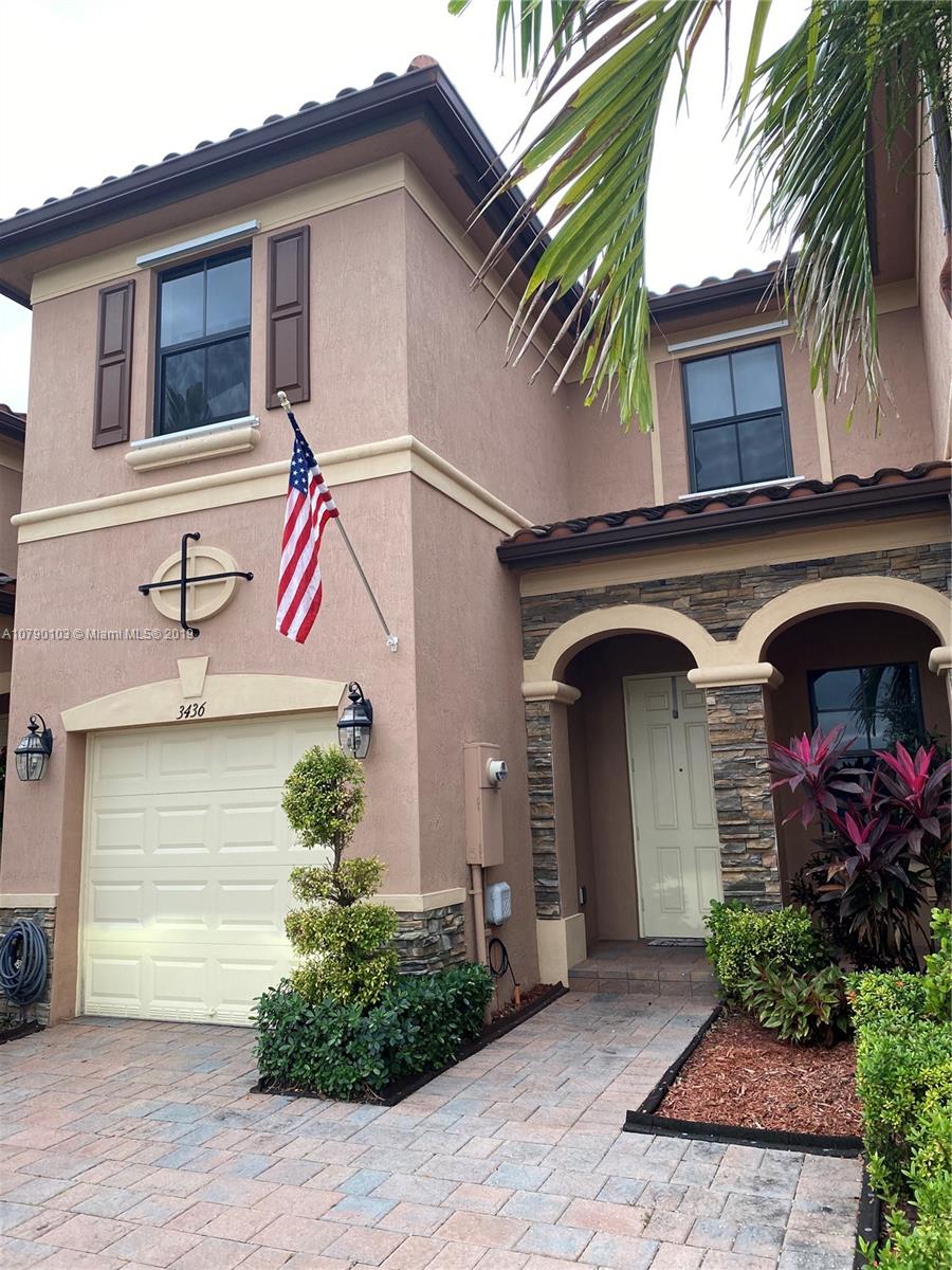 3436 West 90th Street, Unit 3436 Hialeah, FL 33018 - Photo 2 of 56 a front view of a house with plants