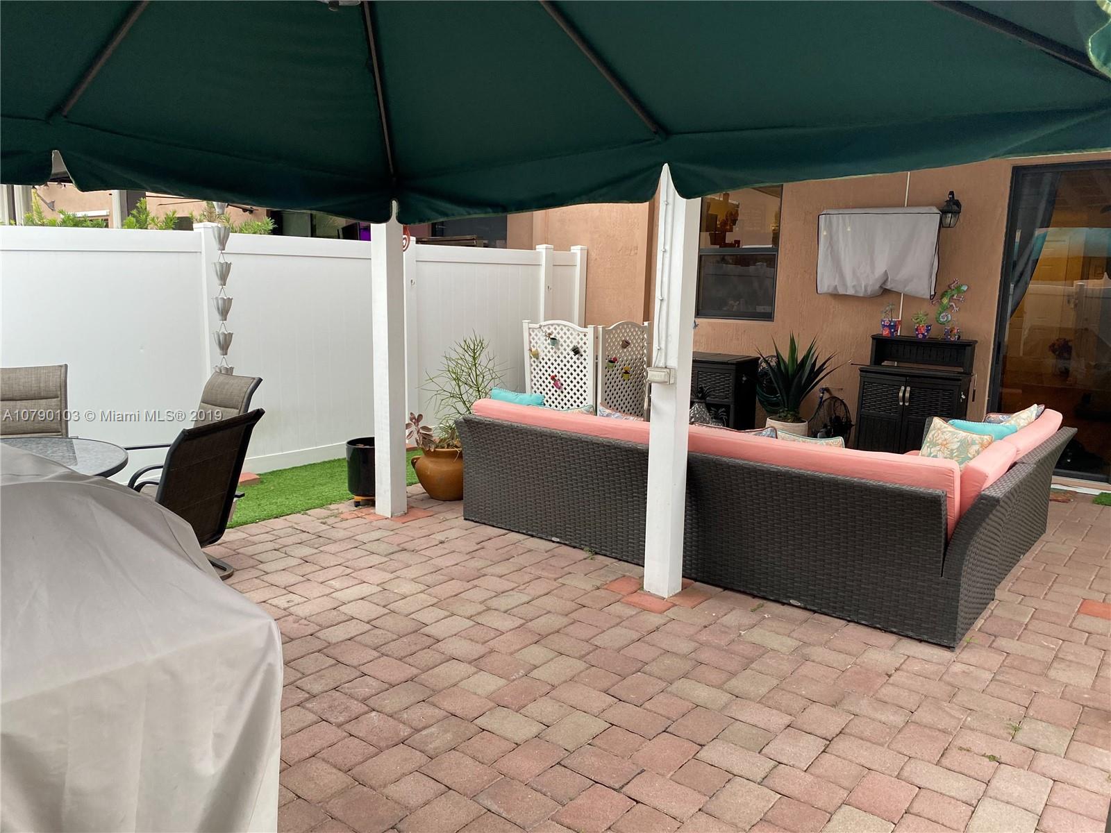3436 West 90th Street, Unit 3436 Hialeah, FL 33018 - Photo 21 of 56 a view of an outdoor sitting area with a couch