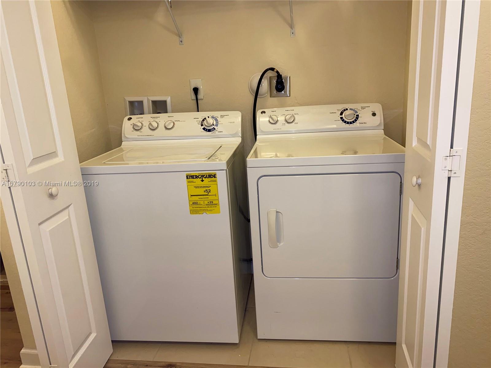 3436 West 90th Street, Unit 3436 Hialeah, FL 33018 - Photo 30 of 56 a utility room with dryer and washer