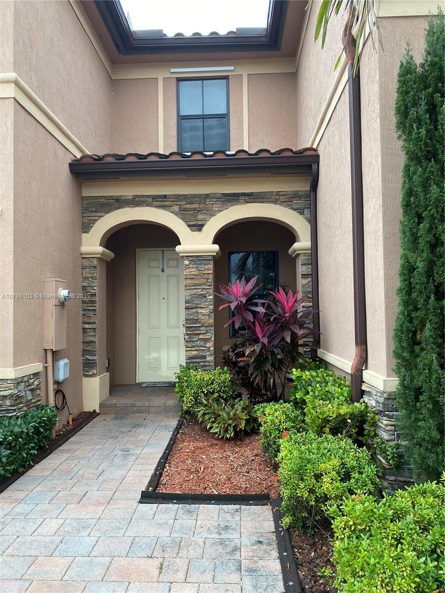 3436 West 90th Street, Unit 3436 Hialeah, FL 33018 - Photo 3 of 56 a front view of a house with garden