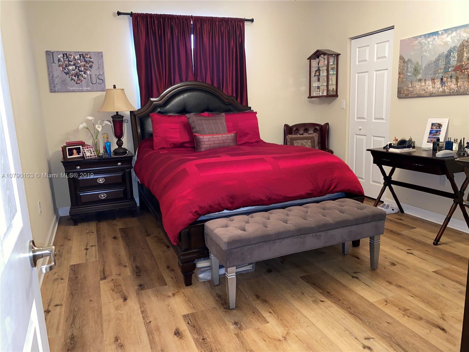 3436 West 90th Street, Unit 3436 Hialeah, FL 33018 - Photo 32 of 56 a bed room with a bed and a chair