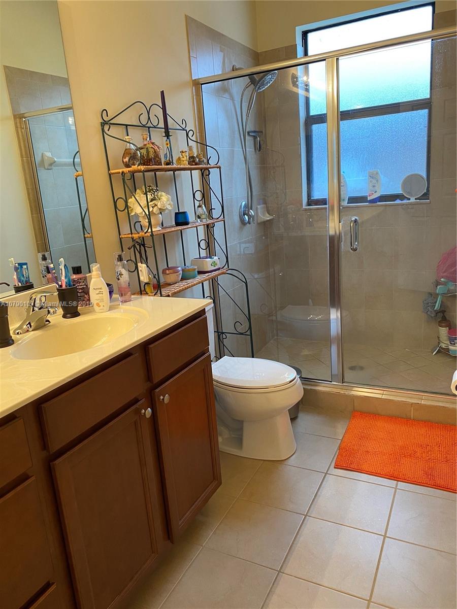 3436 West 90th Street, Unit 3436 Hialeah, FL 33018 - Photo 39 of 56 a bathroom with a sink toilet and shower