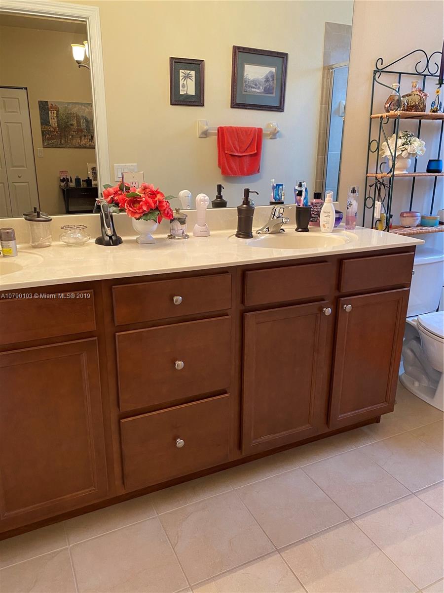 3436 West 90th Street, Unit 3436 Hialeah, FL 33018 - Photo 40 of 56 a bathroom with a sink vanity and mirror
