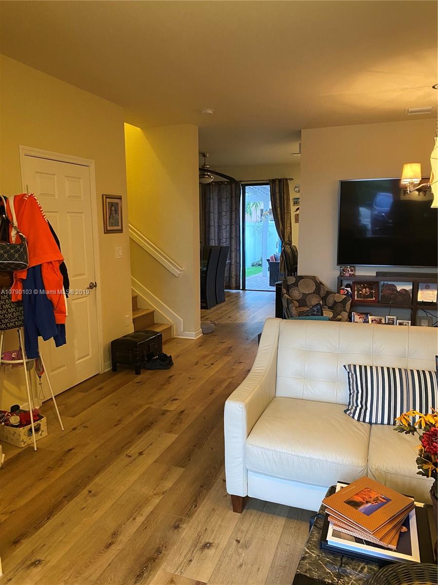 3436 West 90th Street, Unit 3436 Hialeah, FL 33018 - Photo 5 of 56 a living room with furniture and a flat screen tv