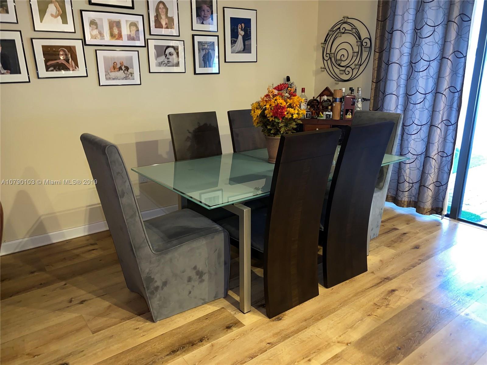 3436 West 90th Street, Unit 3436 Hialeah, FL 33018 - Photo 8 of 56 a dining room with furniture and window