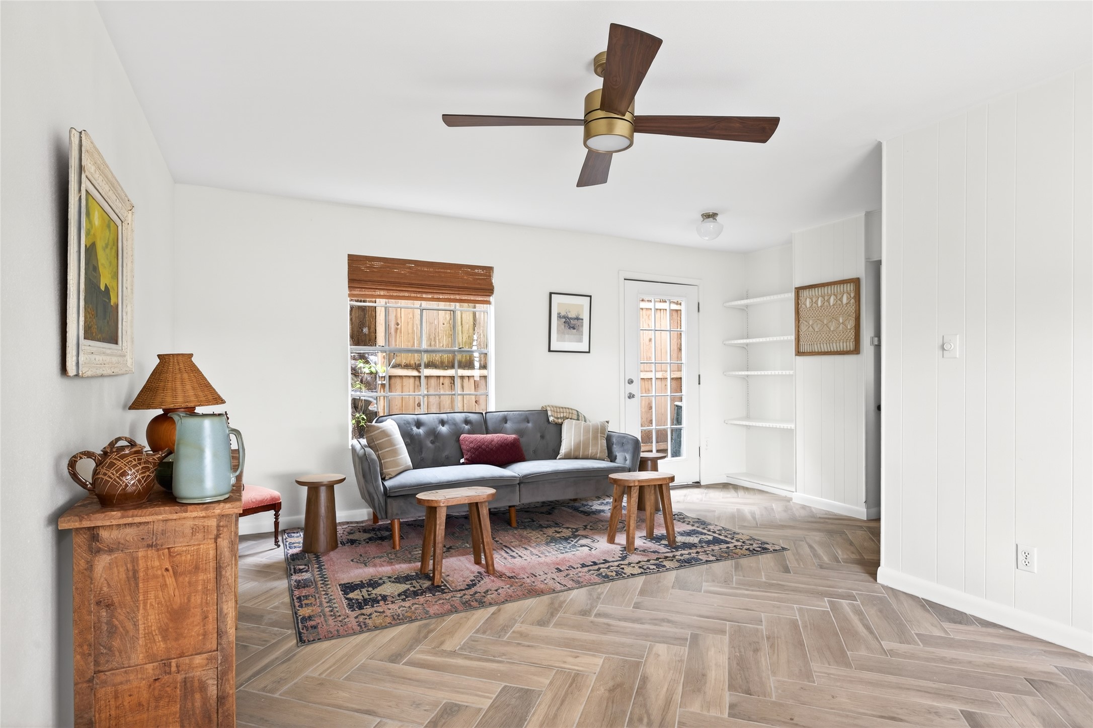 a living room with furniture and a window