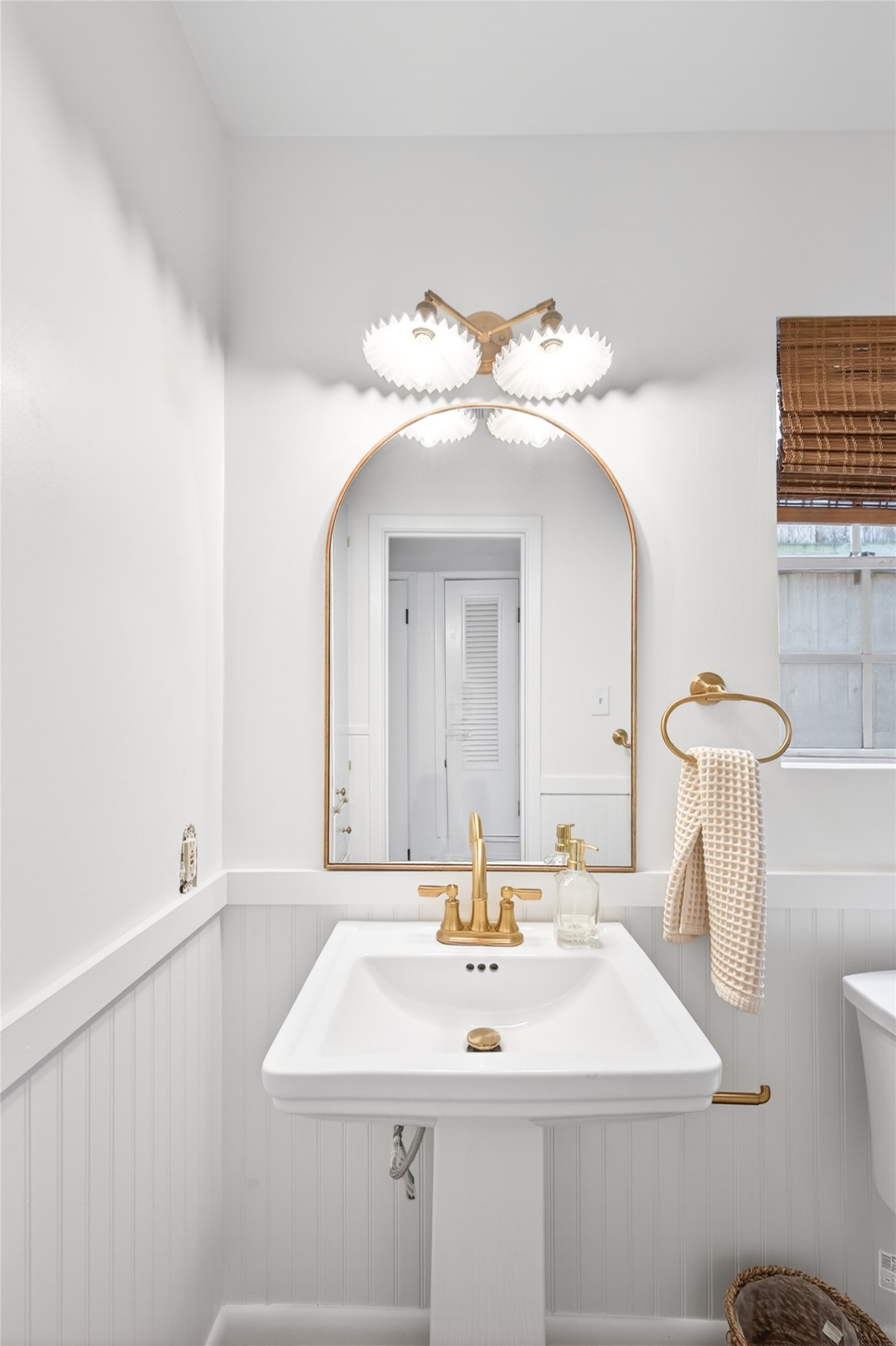1700 Houston Street, Unit 102 Austin, TX 78756 - Photo 14 of 24 a bathroom with a sink and a mirror