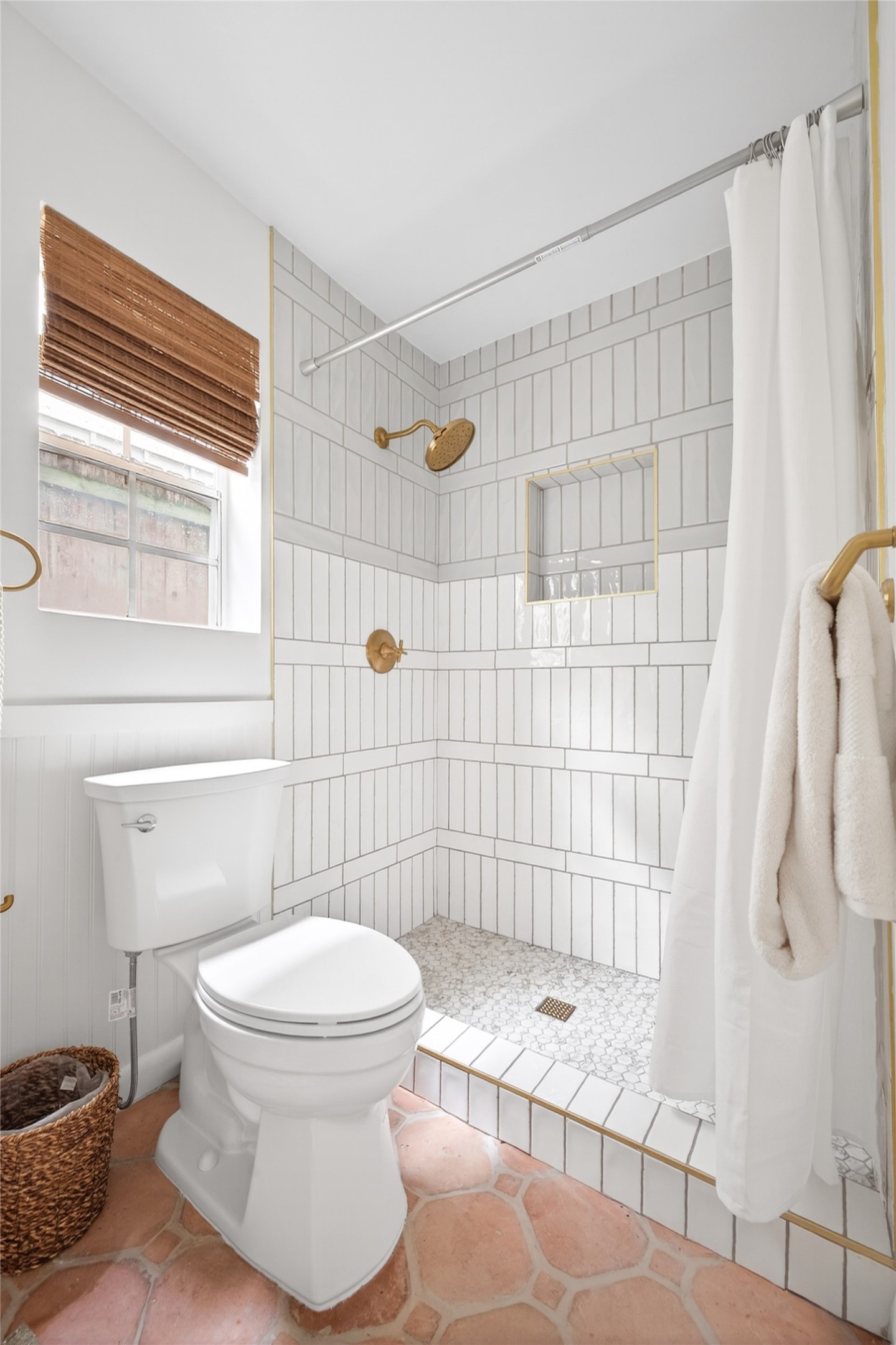 1700 Houston Street, Unit 102 Austin, TX 78756 - Photo 16 of 24 a bathroom with a toilet and shower