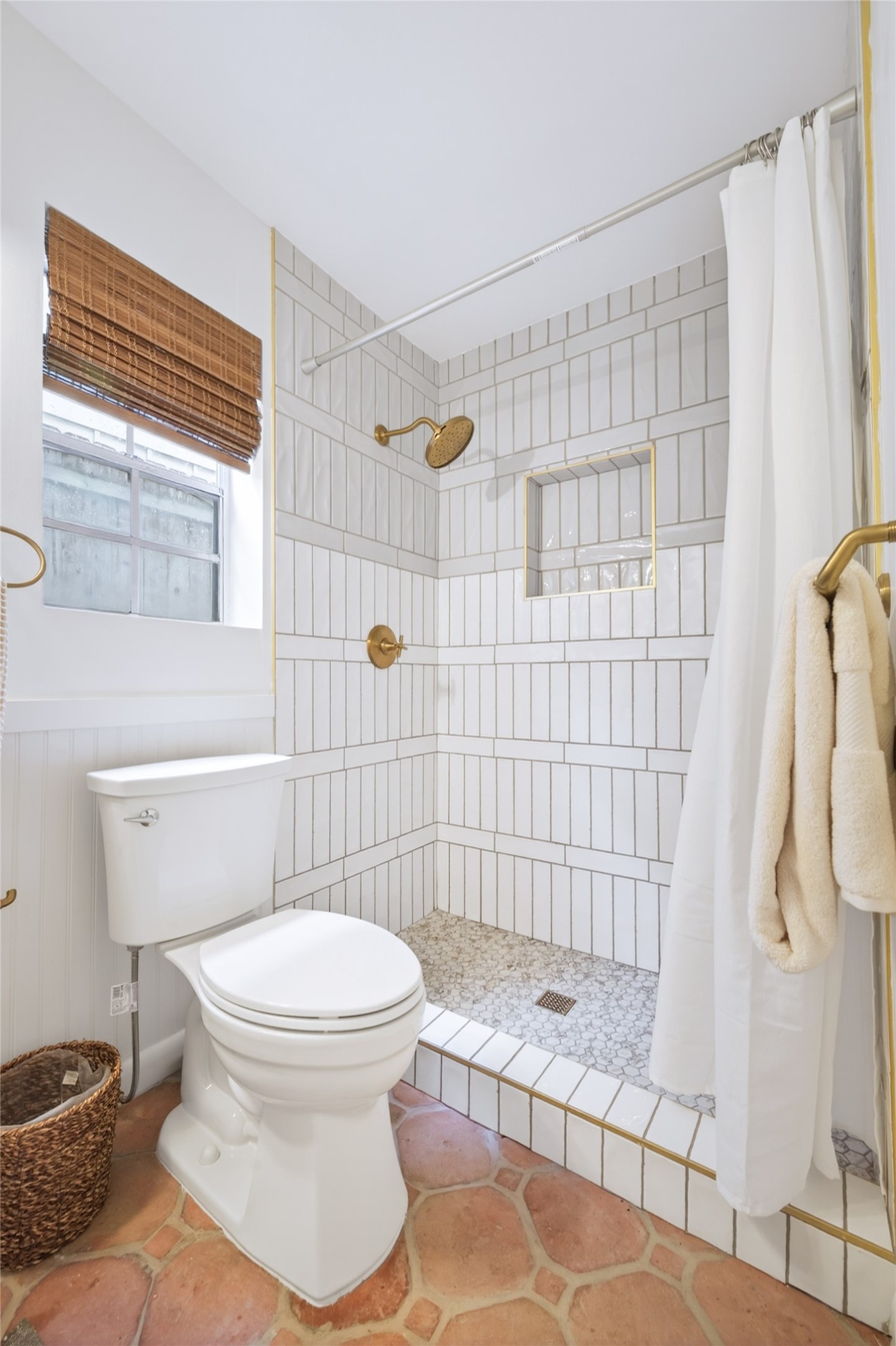 1700 Houston Street, Unit 102 Austin, TX 78756 - Photo 17 of 24 a bathroom with a toilet and shower