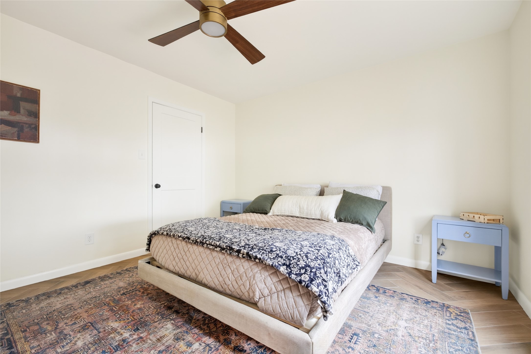 1700 Houston Street, Unit 102 Austin, TX 78756 - Photo 19 of 24 a bedroom with a bed and a cabinets