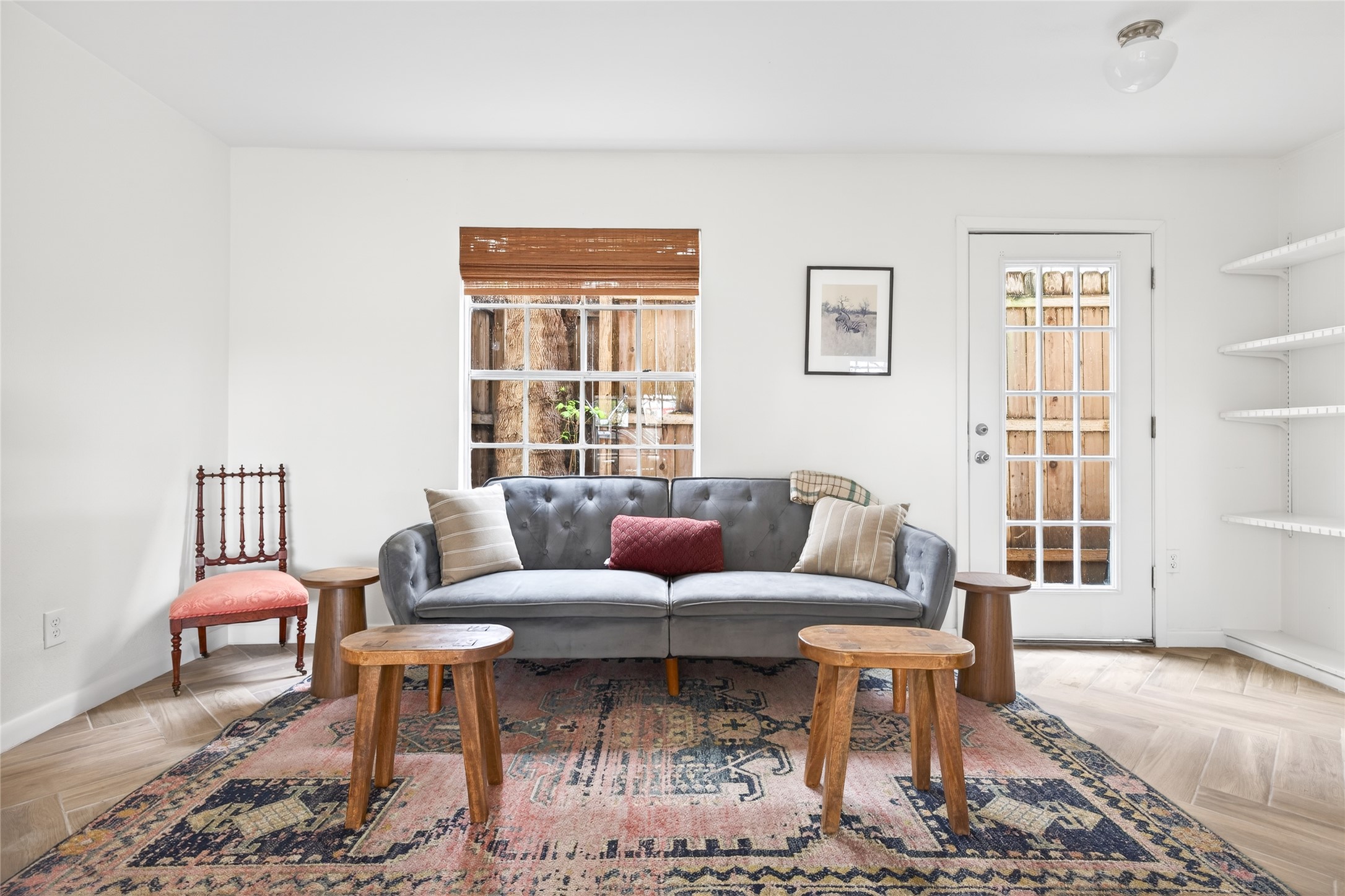 1700 Houston Street, Unit 102 Austin, TX 78756 - Photo 2 of 24 a living room with furniture a rug and a window