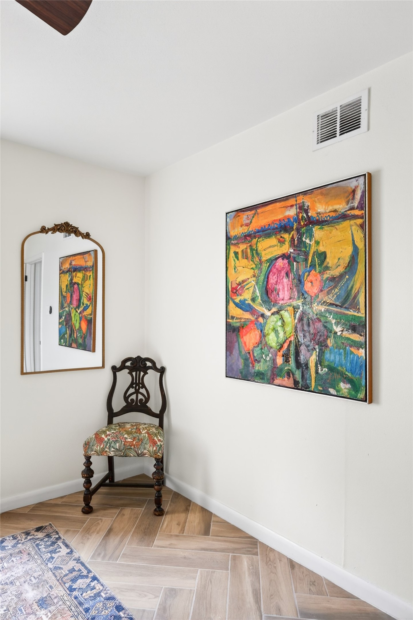 1700 Houston Street, Unit 102 Austin, TX 78756 - Photo 21 of 24 a bedroom with a bed and painting on the wall