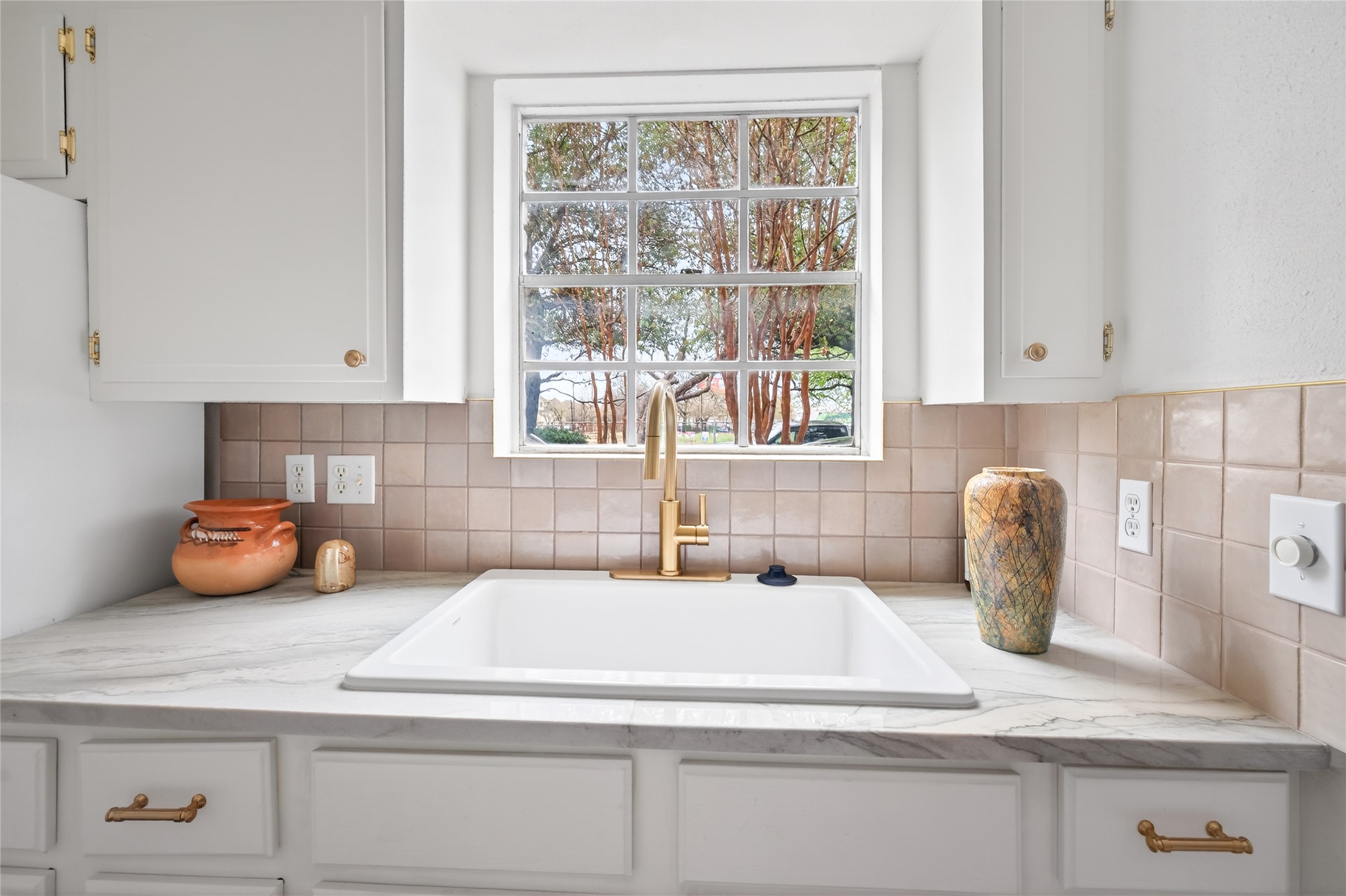 1700 Houston Street, Unit 102 Austin, TX 78756 - Photo 7 of 24 a kitchen with a sink and a window