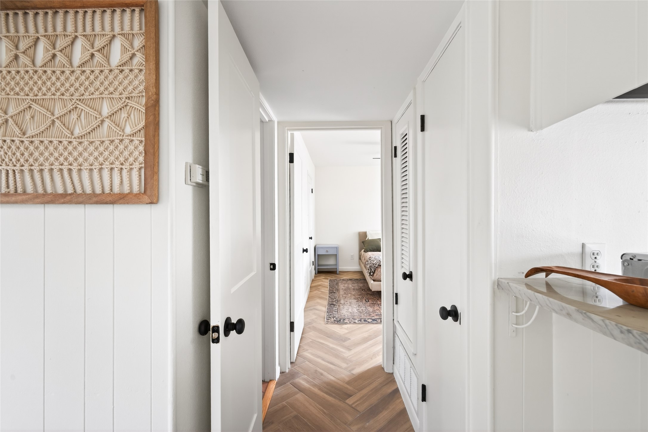 1700 Houston Street, Unit 102 Austin, TX 78756 - Photo 10 of 24 a view of a hallway with a closet and a bathroom