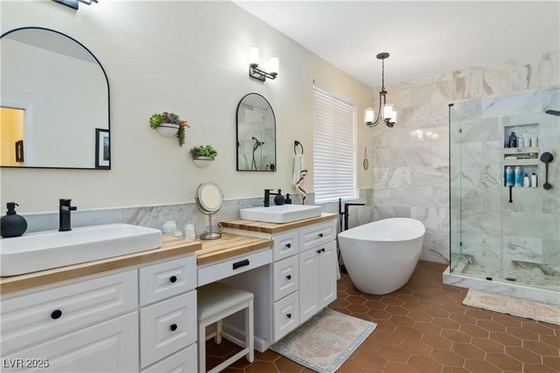2344 Teton Ranch Avenue Henderson, NV 89052 - Photo 14 of 32 Eleganty ugraded bathroom with walk-in shower and soaking tub.