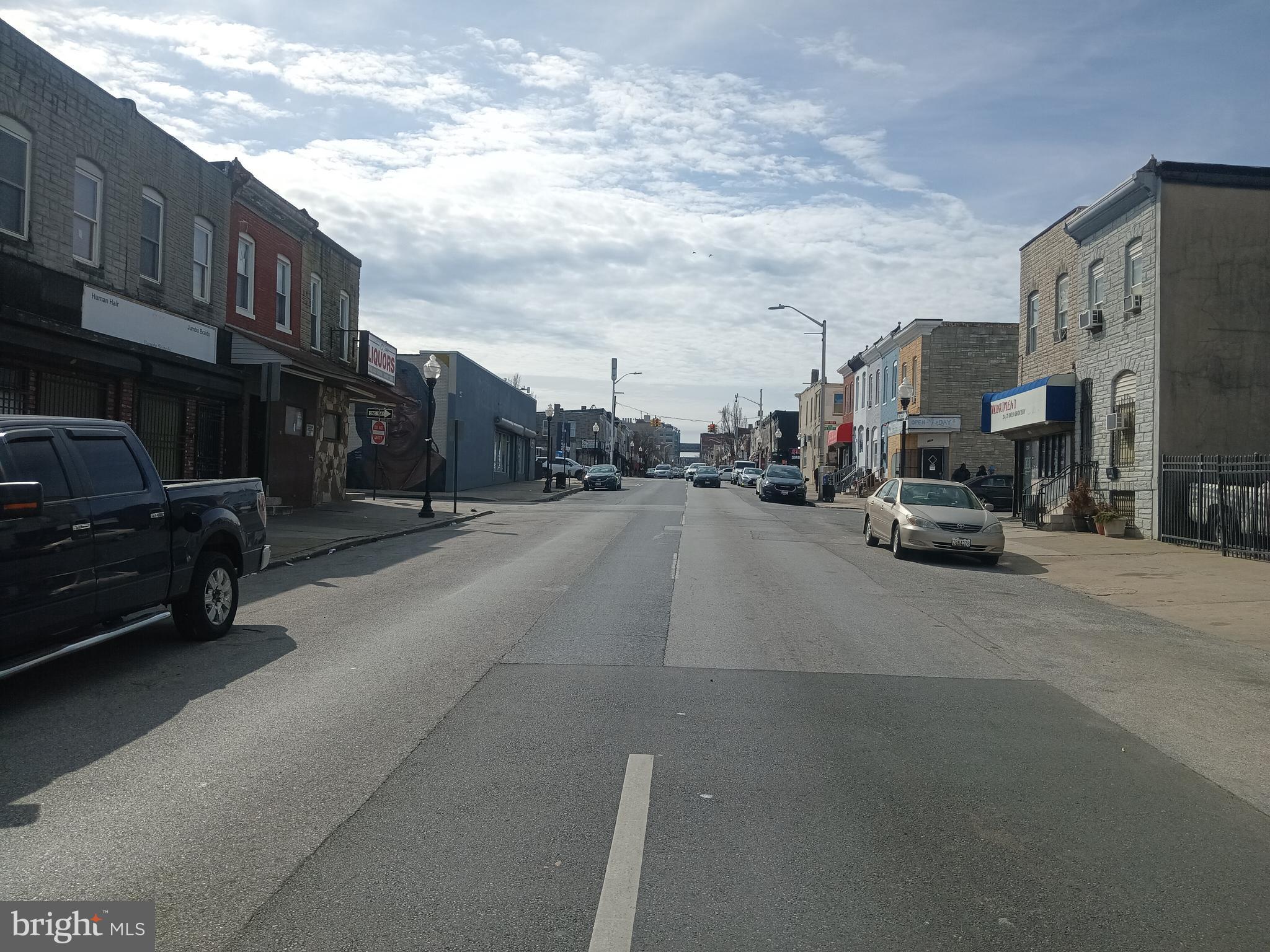 2535 East Monument Street Baltimore, MD 21205 - Photo 12 of 13 a view of a street with cars