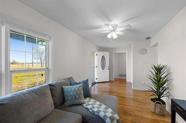 a living room with furniture and window