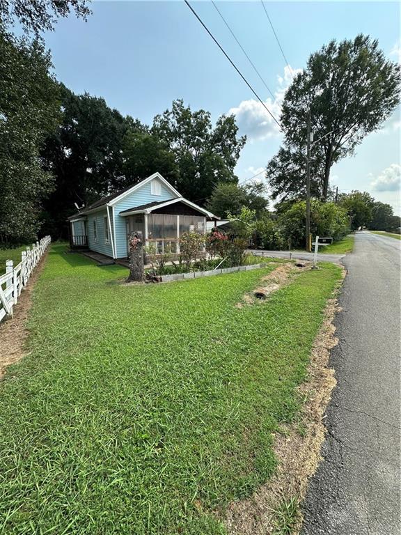 201 North King Street Calhoun, GA 30701 - Photo 1 of 13 a view of a house with a yard
