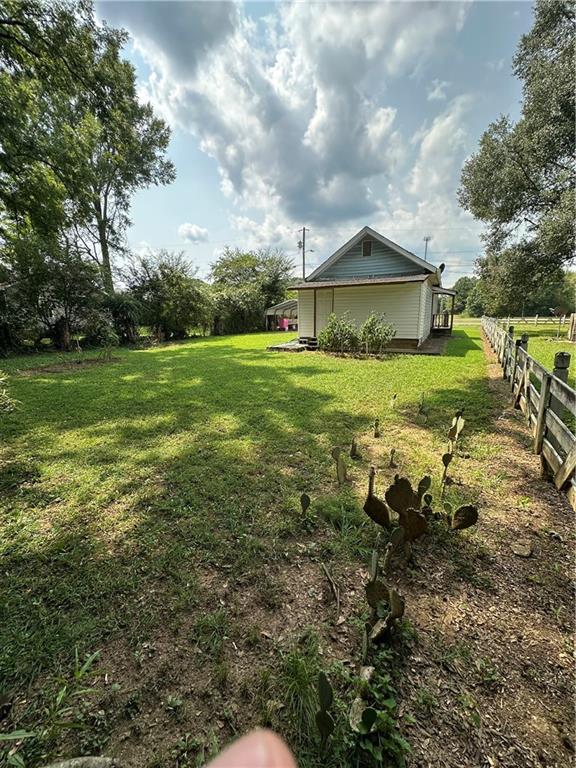 201 North King Street Calhoun, GA 30701 - Photo 4 of 13 a view of a house with a yard and sitting area