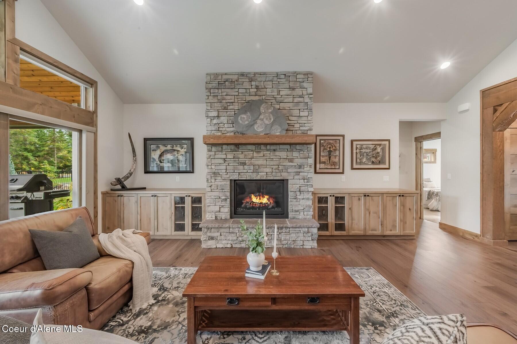 12091 North Tracey Road Hayden, ID 83835 - Photo 10 of 49 Cozy Warm Rock Fireplace