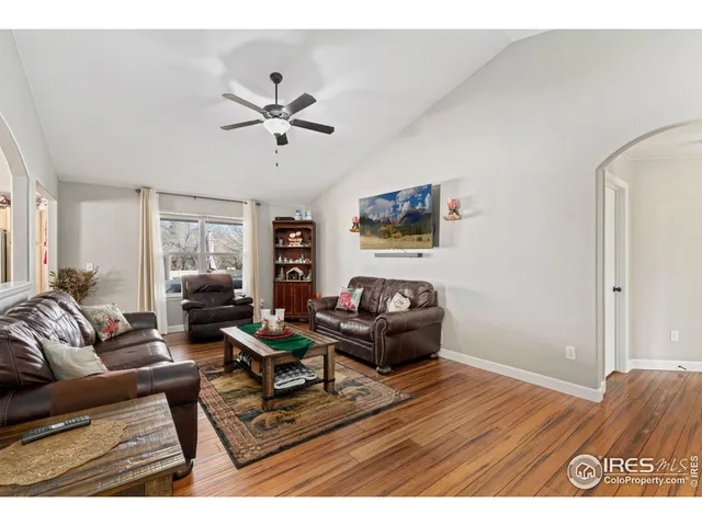 a kitchen with stainless steel appliances granite countertop a refrigerator a stove top oven a sink and dishwasher