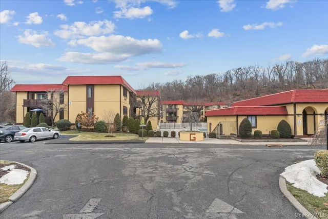 a view of a street with houses on both side