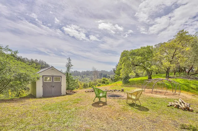 a view of an chairs and table in the patio