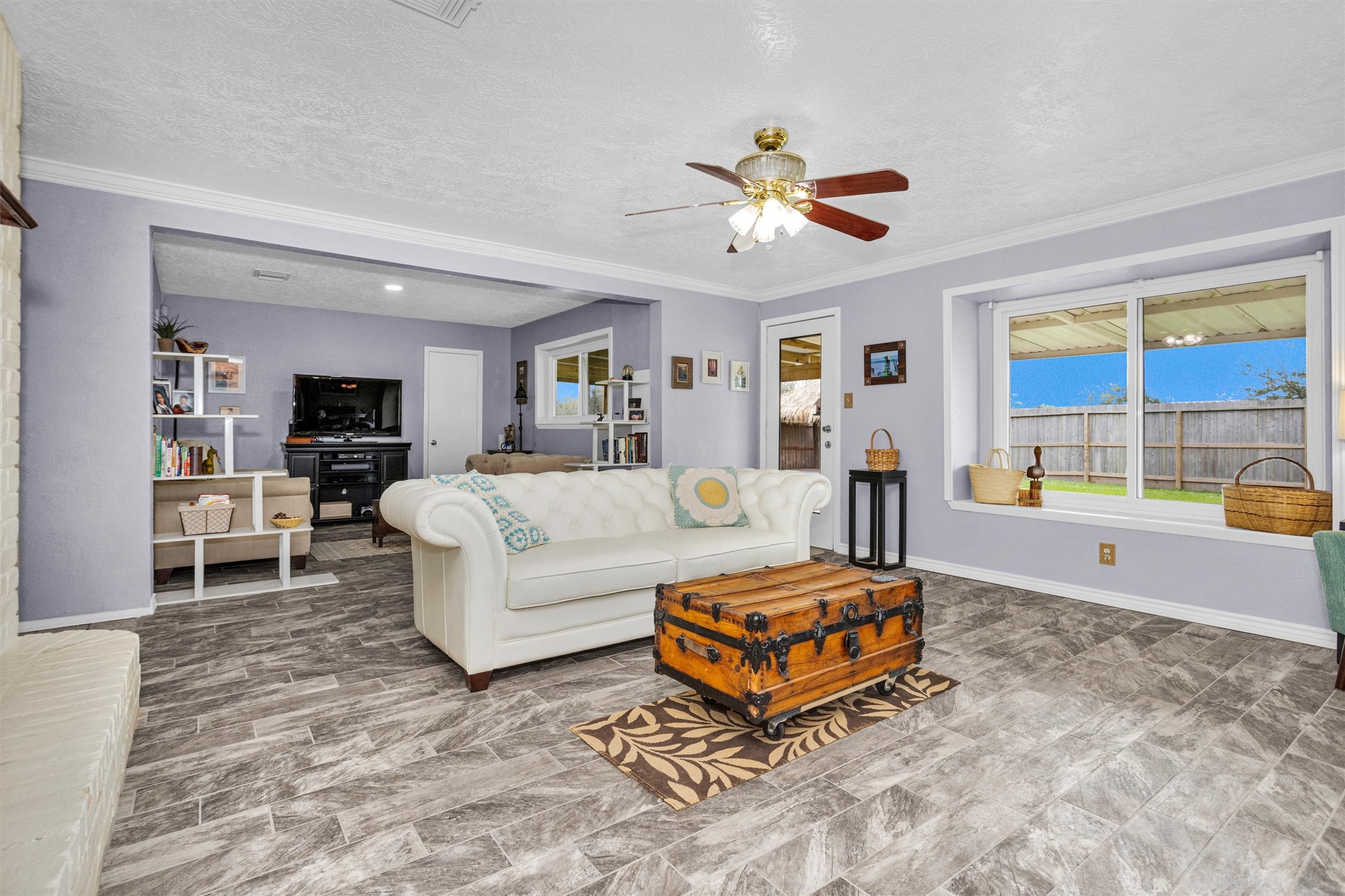 8422 Oakhaven Road La Porte, TX 77571 - Photo 7 of 46
Bright living space featuring large windows that allow natural light to fill the room.