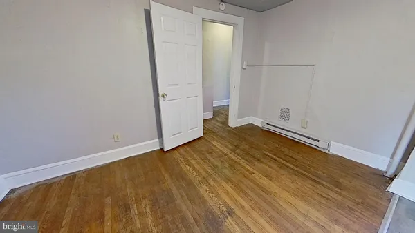 a view of a kitchen with refrigerator and cabinet