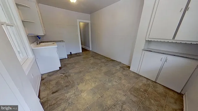 a view of a bathroom with a sink and a window