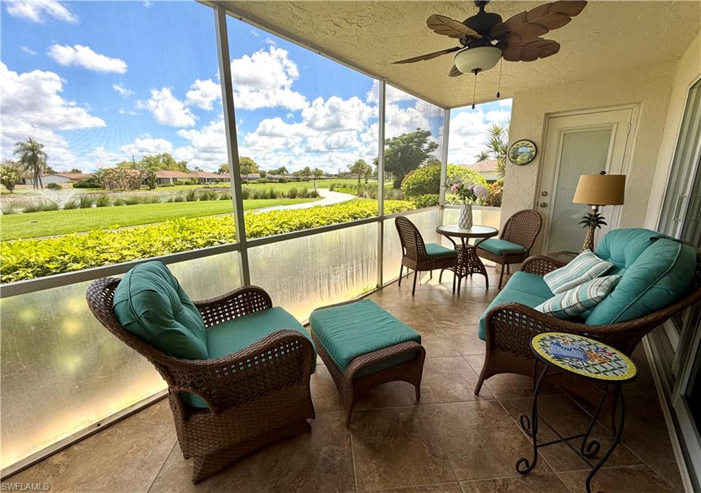 105 Penny Lane, Unit 5 Naples, FL 34112 - Photo 1 of 15 a living room with furniture and a large window