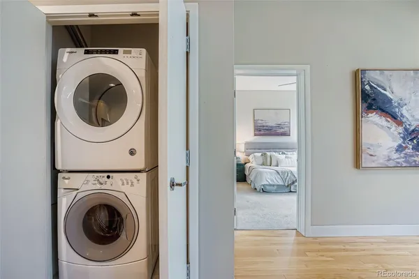a view of a hallway with washer and dryer
