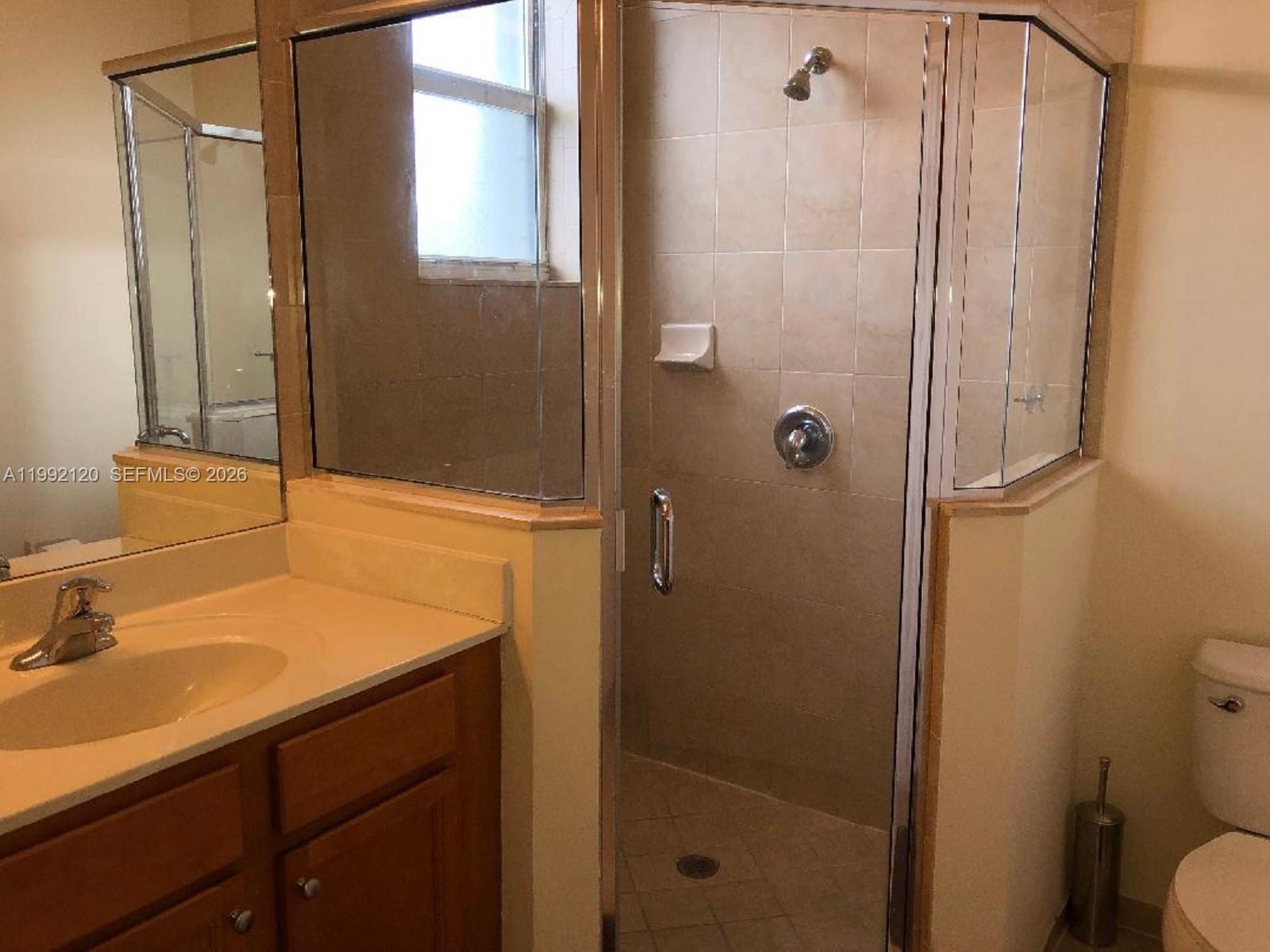 17000 Southwest 90th Terrace Miami, FL 33196 - Photo 6 of 56 a bathroom with a sink and mirror