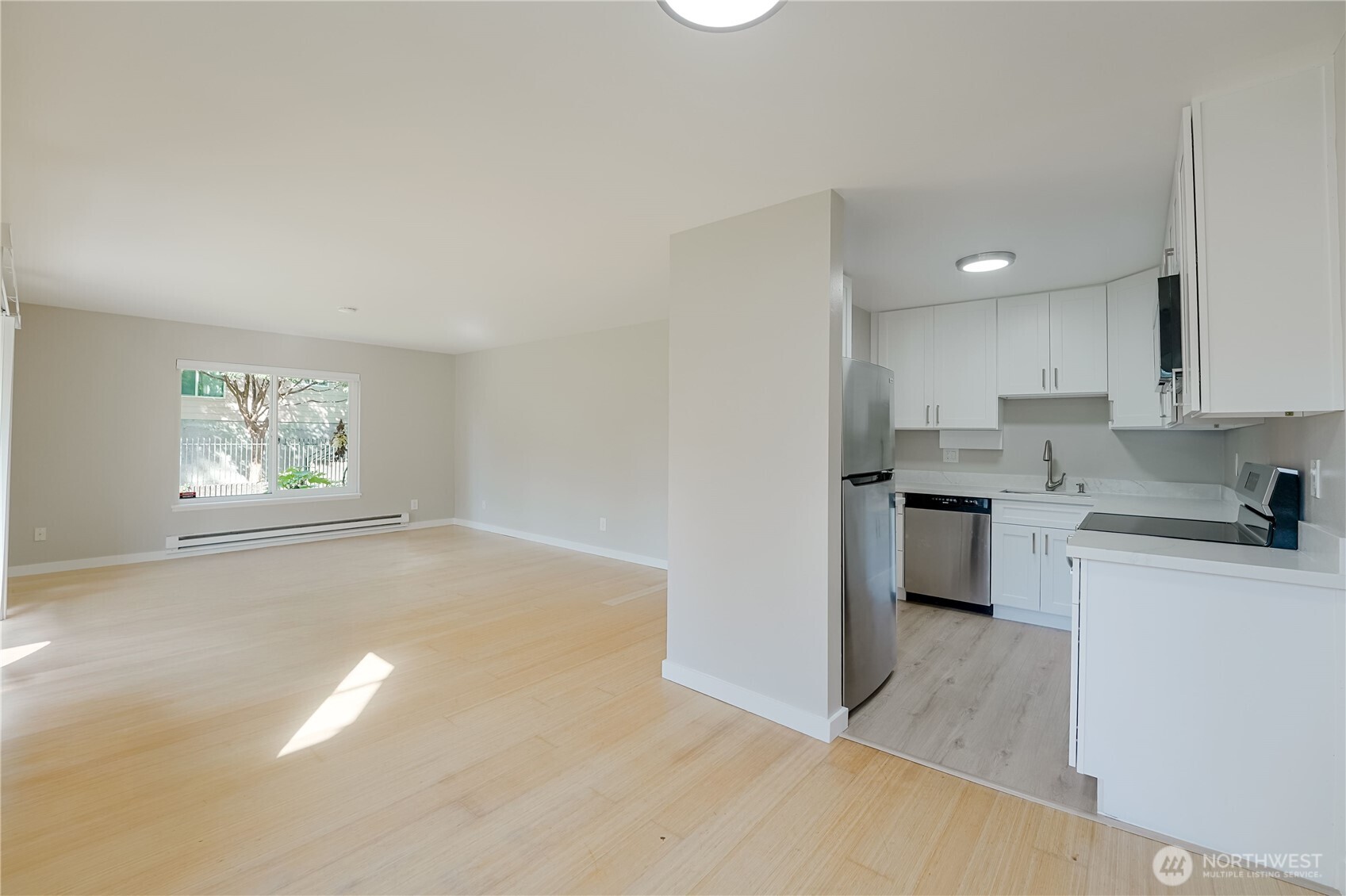 1100 South Atlantic Street, Unit 209 Seattle, WA 98134 - Photo 11 of 31 a view of kitchen with stove and cabinets