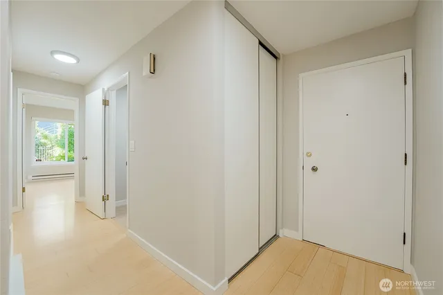 a bedroom with a bed and a potted plant